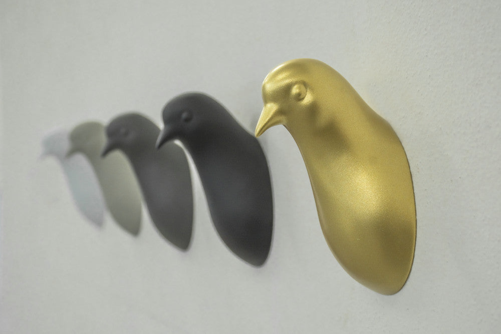 Pigeon head coat hanger by claudio bitetti