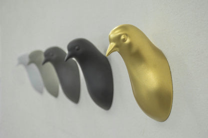 Pigeon head coat hanger by claudio bitetti