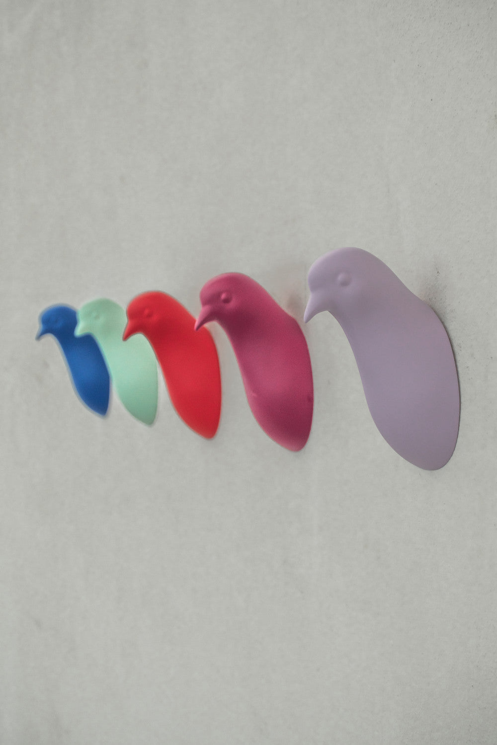 Pigeon head coat hanger by claudio bitetti
